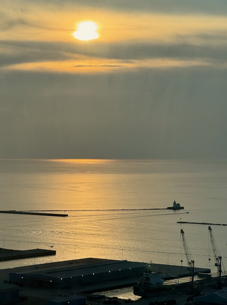 Setting sun over a great lake from high up in a skyscraper